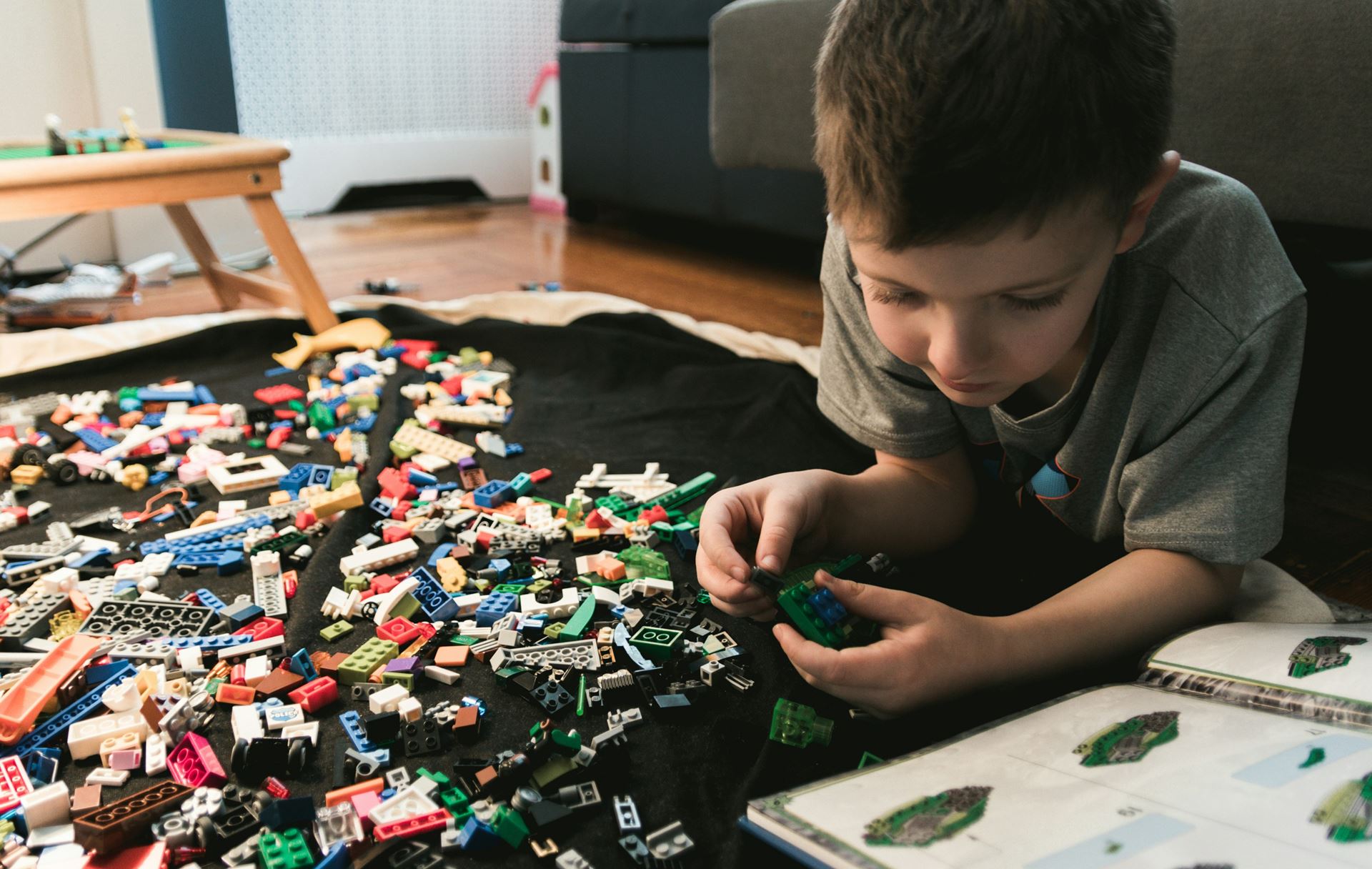 Child paying with lego